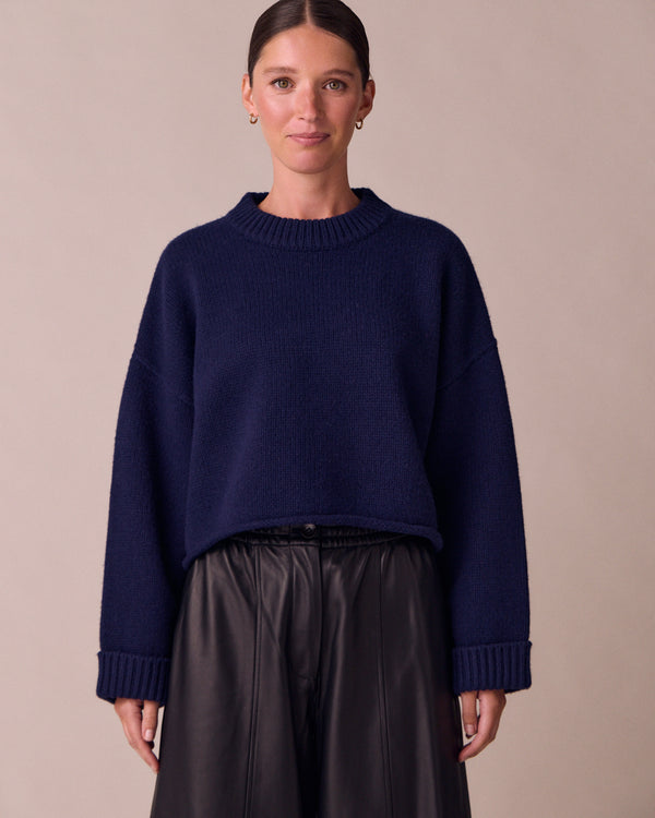 model wears coco navy knitted jumper