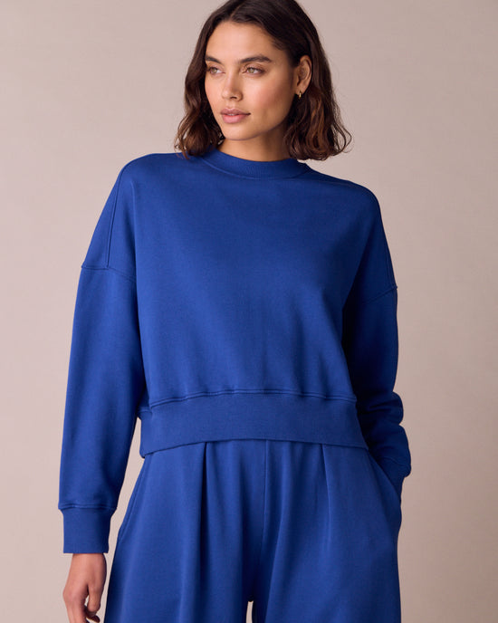 model wears eden cobalt jersey fleeceback jumper