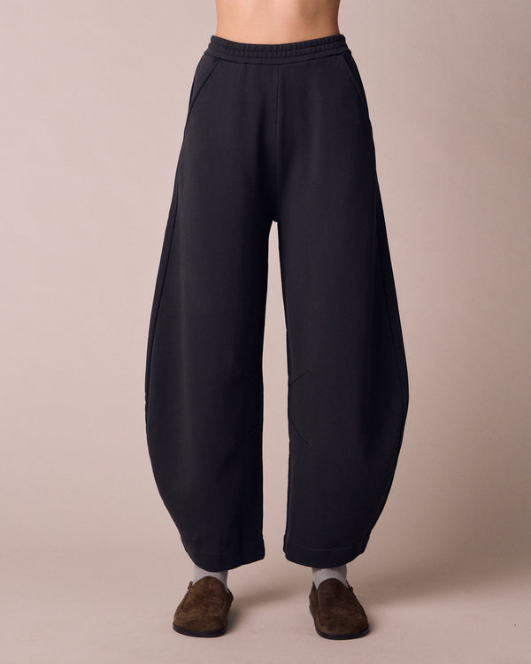 model wears helina washed black jersey trousers front