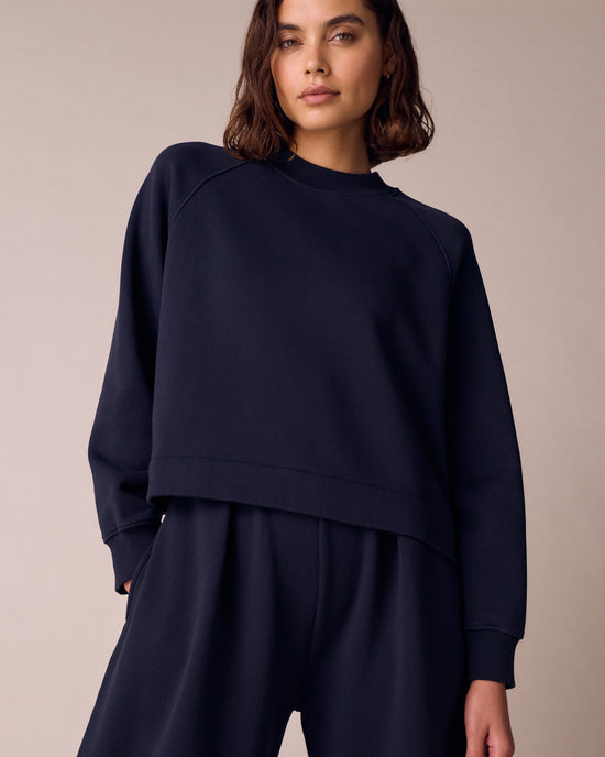 model wears noa ink jersey jumper