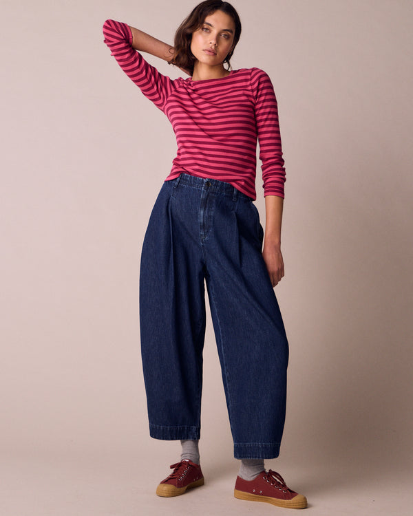 model wears veda dark wash denim jeans right