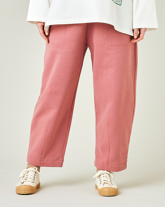 model wears dusty pink jersey huxley trousers front