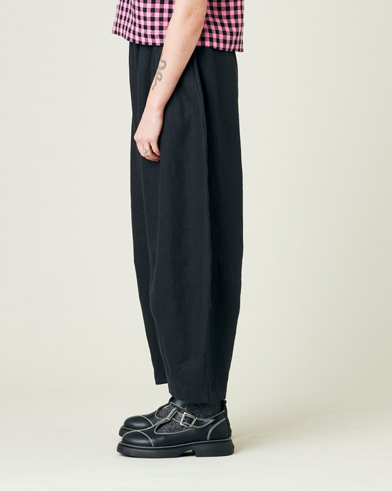 model wears black daisy linen trousers 