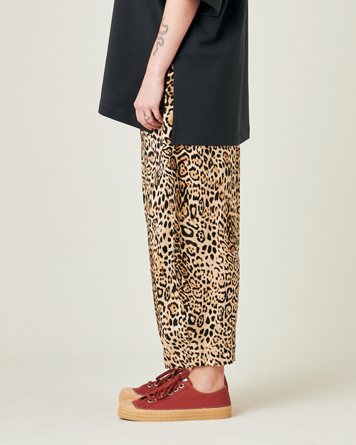 model wears leopard print cupro mabel trousers left