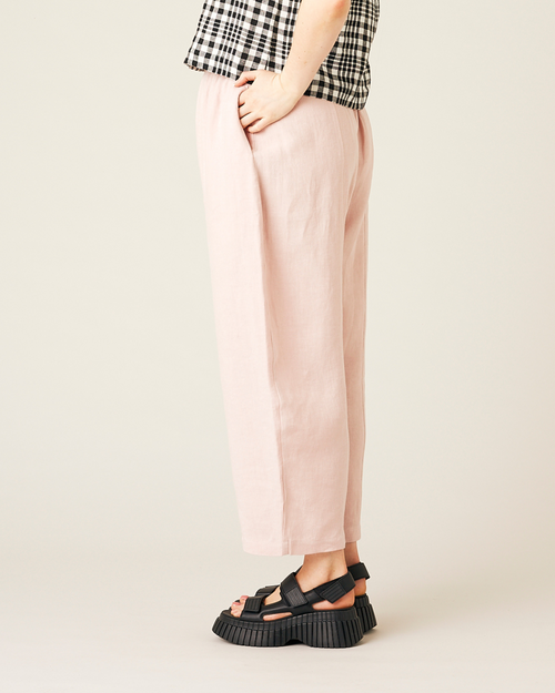 model wears rose linen mabel trousers left 