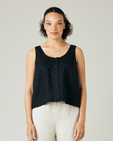 model wears black linen betty top