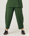 model wears kombu green jersey huxley trousers front