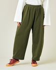 model wears olive jersey mabel trousers front