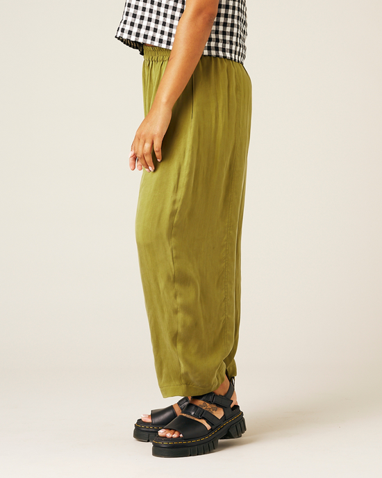 model wears olive cupro mabel trousers left