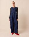 model wears ada dark blue denim jumpsuit