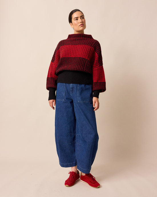 model wears chelsea red and black check knitted jumper