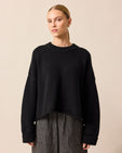 model wears coco black knitted jumper