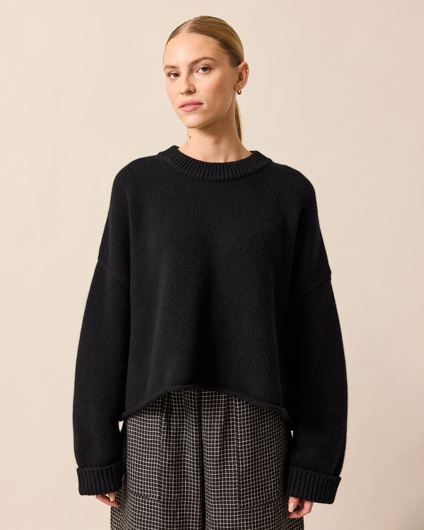 model wears coco black knitted jumper
