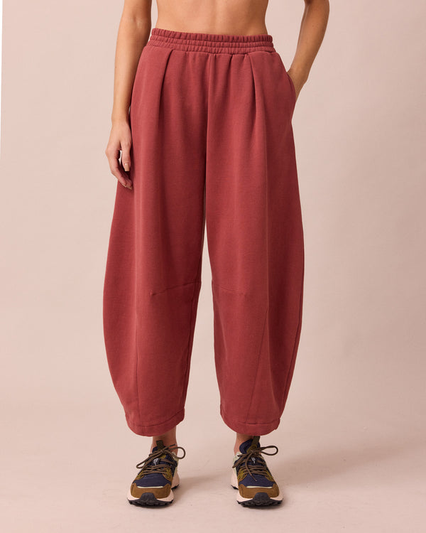 model wears daisy brick fleece jersey trousers front