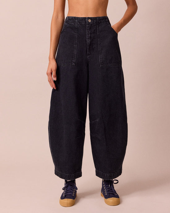 model wears dani washed black denim jeans front