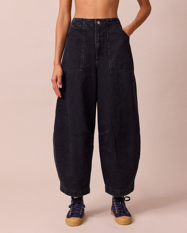 model wears dani washed black denim jeans front