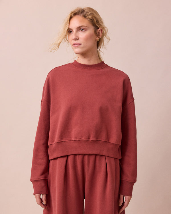 model wears eden brick fleeceback jersey jumper