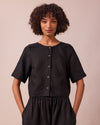 model wears evelyn black linen top