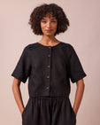 model wears evelyn black linen top