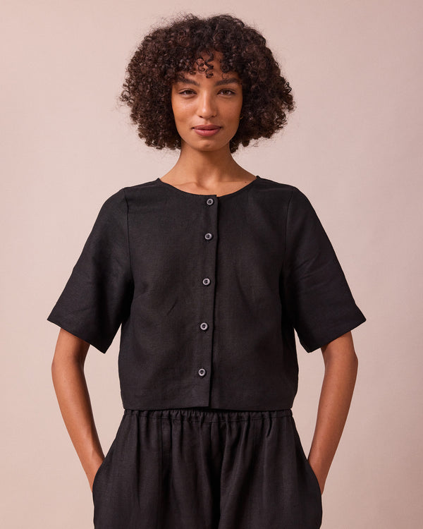 model wears evelyn black linen top