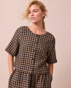 model wears evelyn coffee gingham linen top front