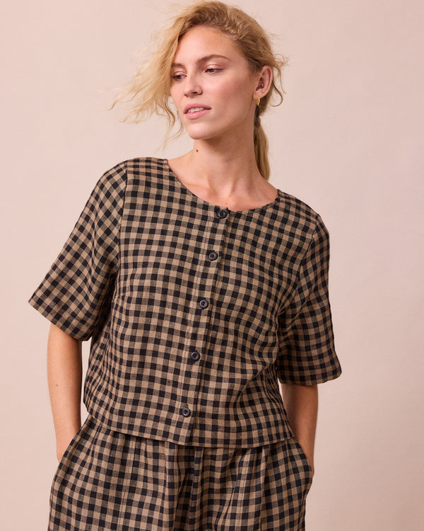 model wears evelyn coffee gingham linen top front