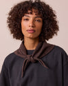 model wears knitted cocoa neckerchief