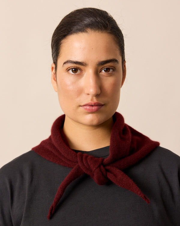 model wears dark burgundy knitted neckerchief