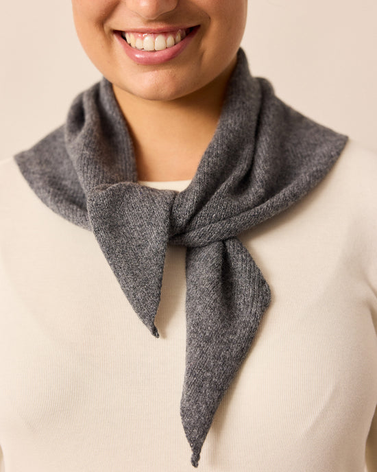 model wears cool grey knitted neckerchief