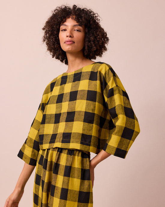 model wears lily chartreuse check linen top
