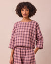 model wears lily dewberry check linen top