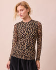 model wears mesh leopard print long sleeved top