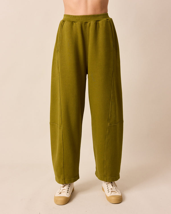 model wears lyra fresh olive jersey trousers front