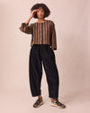 model wears mabel black cord trousers right