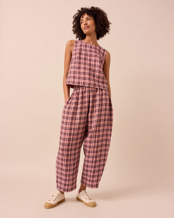 model wears mabel dewberry check linen trousers right