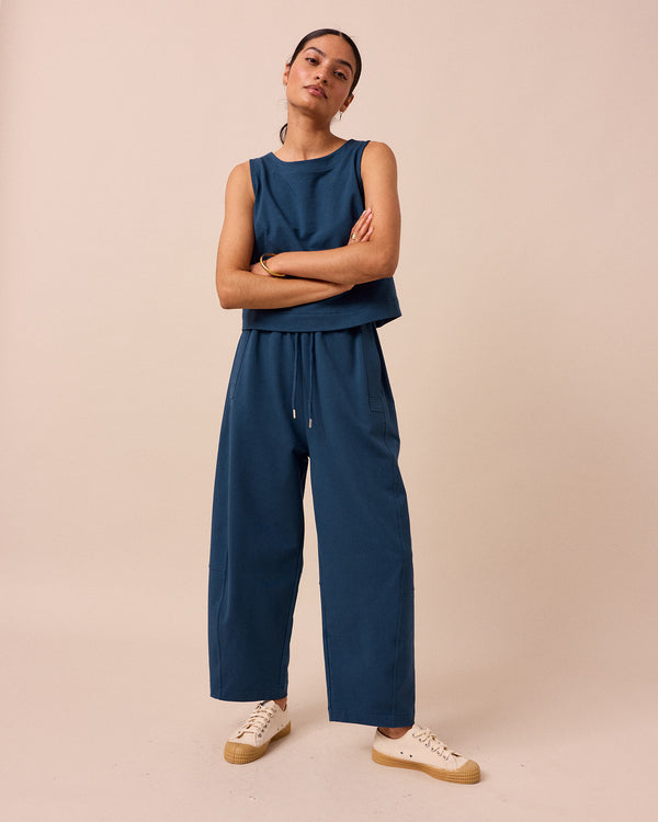 model wears madi french navy jersey trousers front