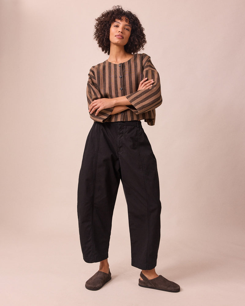 model wears millie black heavy cotton trousers right