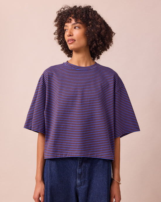 model wears nova brown and blue stripe jersey top