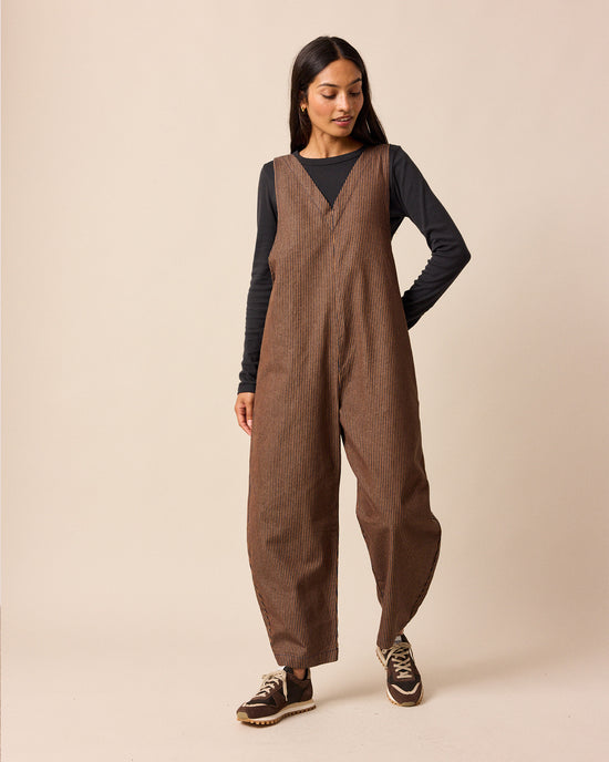 model wear ottie rust hickory stripe denim jumpsuit