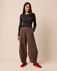 model wears pascale chocolate fleeceback jersey trousers right