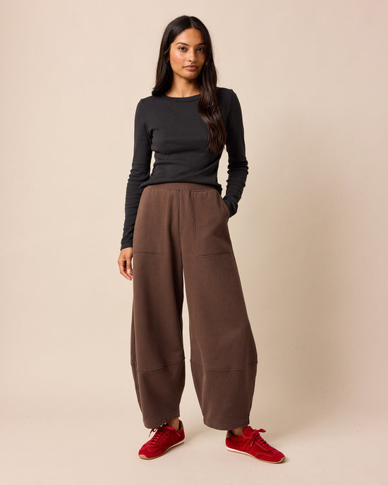 model wears pascale chocolate fleeceback jersey trousers right