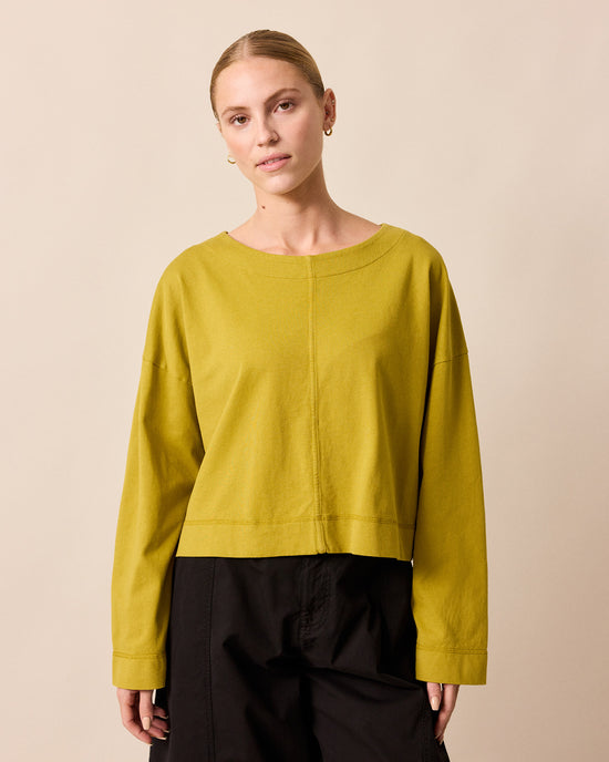 model wears peggy golden pear jersey top