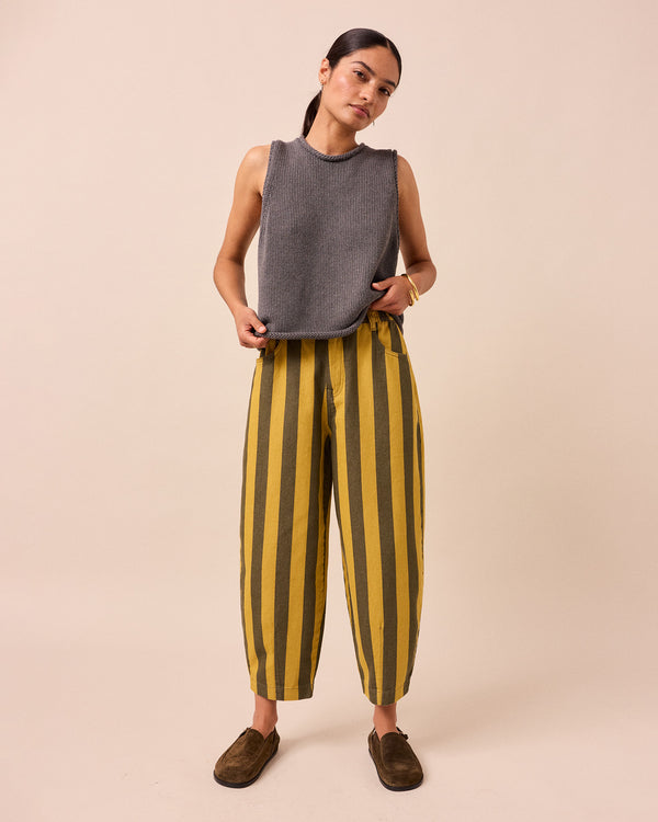 model wears citrine and forest stripe remi denim jeans front