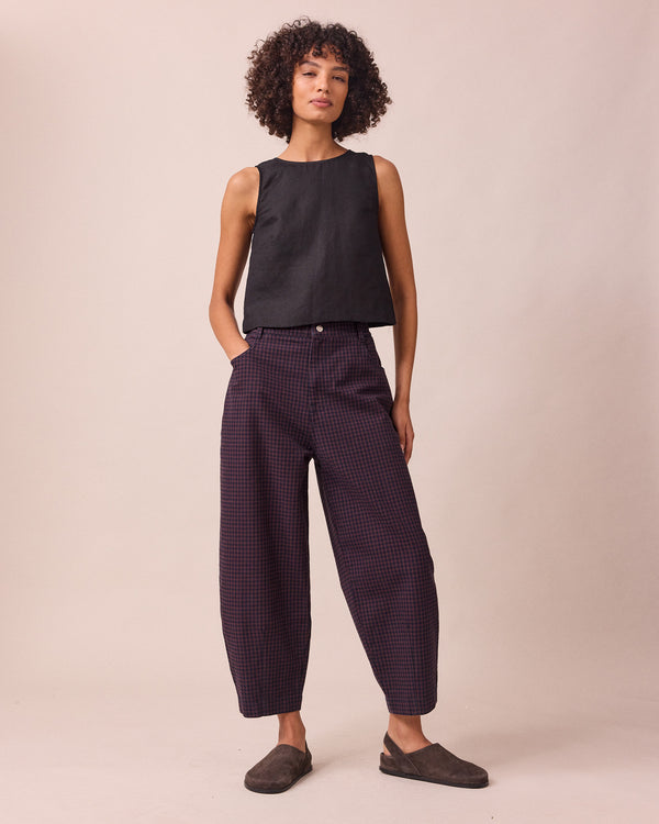 model wears remi mulberry gingham denim jeans front