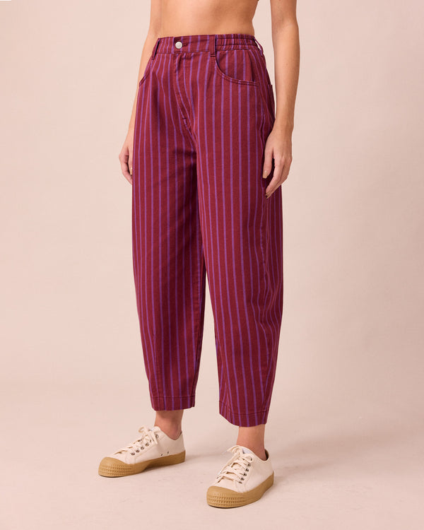 model wears remi russet and violet denim jeans 
