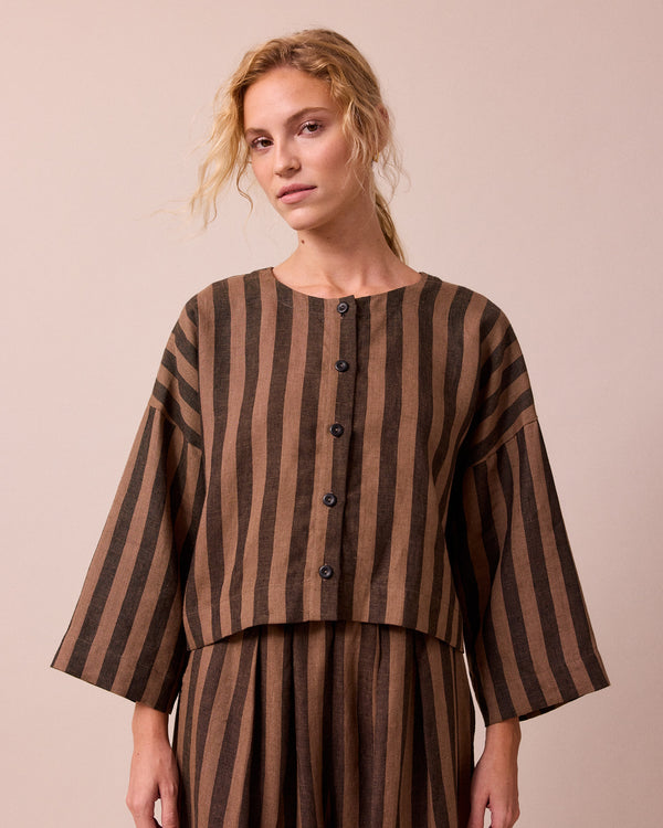 model wears romy walnut stripe linen top