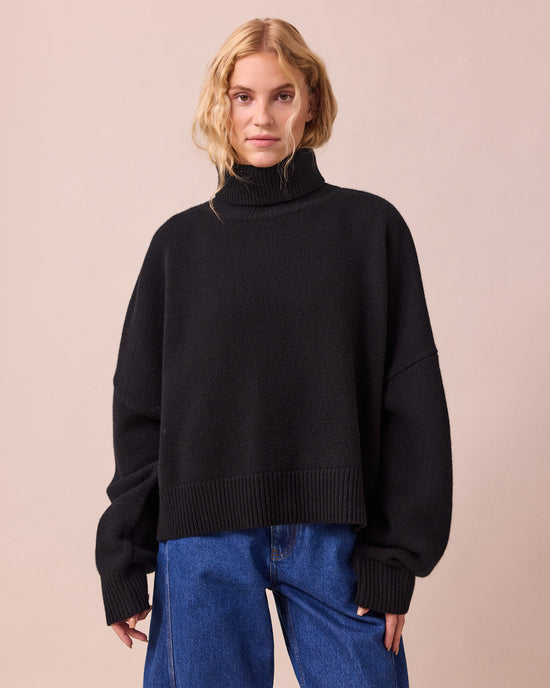 model wears ruth black knitted jumper
