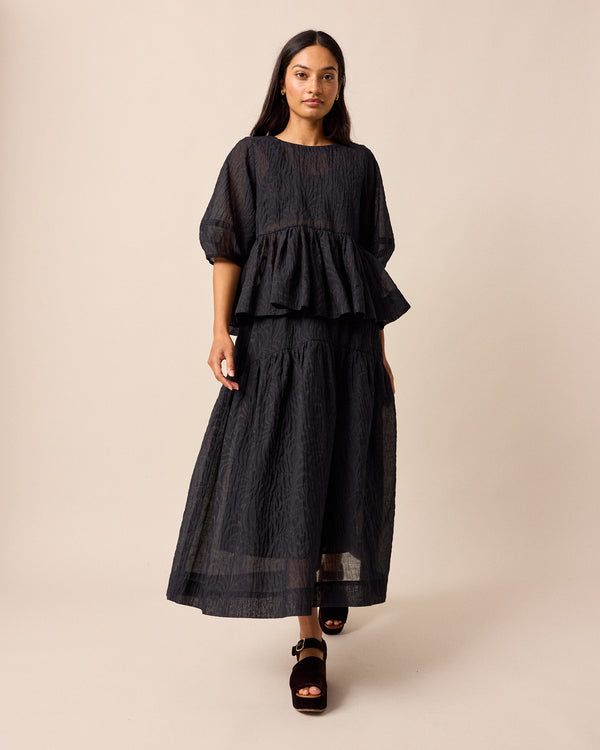 model wears talia black organza skirt