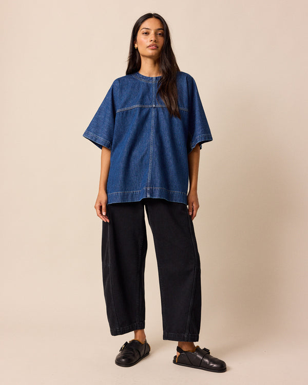 model wears tori washed black denim jeans right