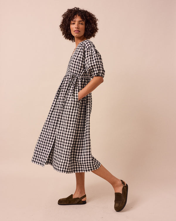 model wears winnie black and white gingham linen dress